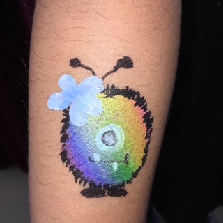 Kleurrijke vlinder glittertattoo